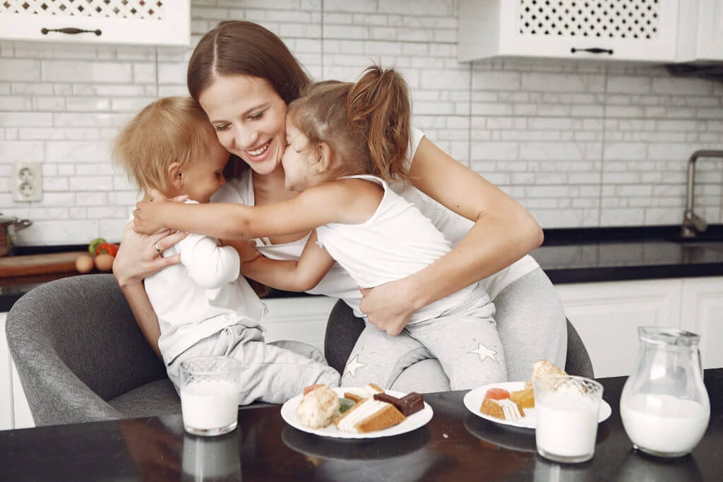 Mom hugging her kids on a peaceful school morning