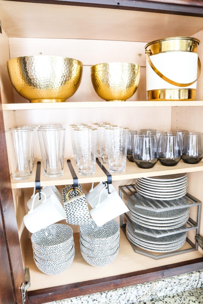 This pic gives a great idea of how to organize your kitchen lids, bowls,  etc.