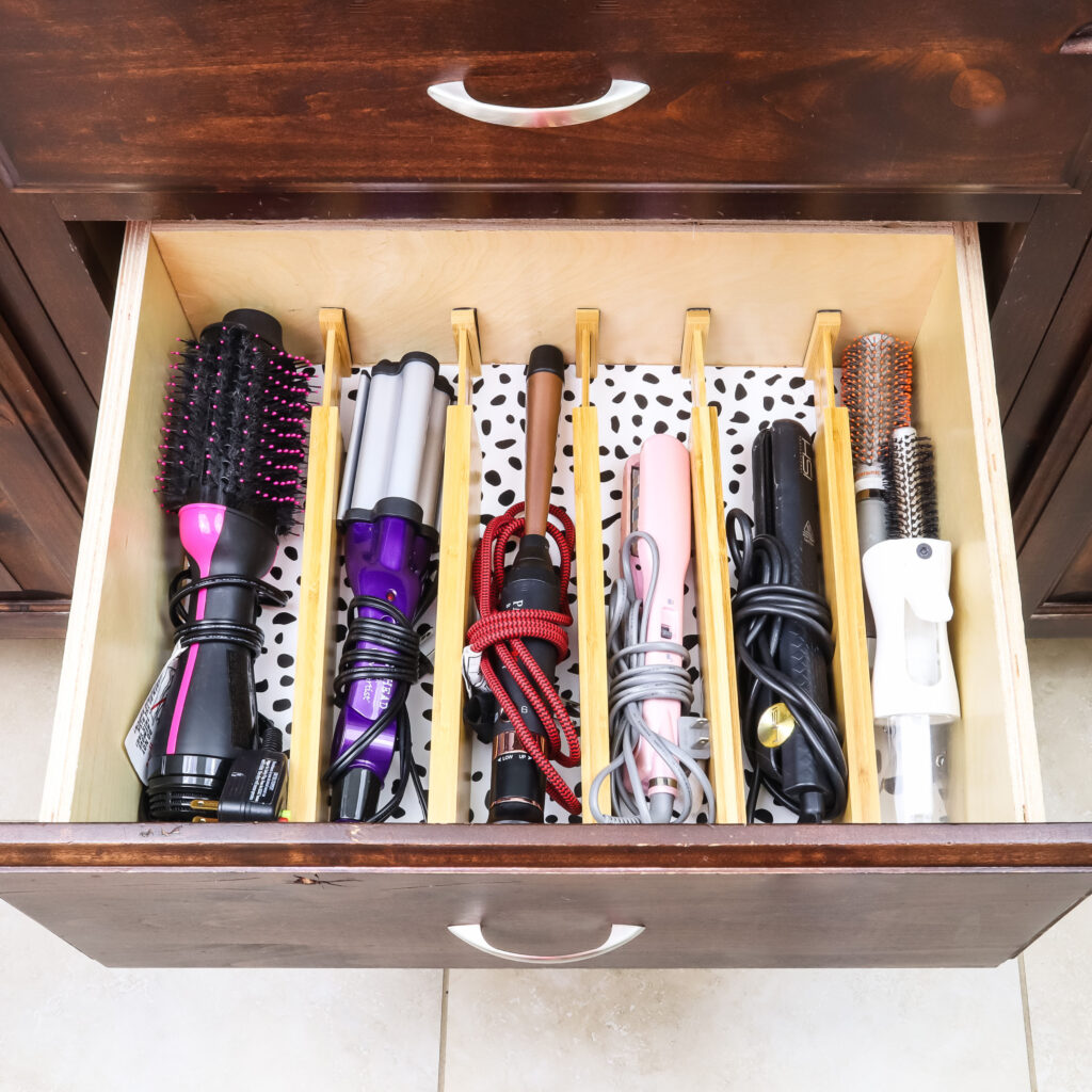 https://practicalperfectionut.com/wp-content/uploads/2022/02/bathroom-drawer-organization-hair-tools-1024x1024.jpg