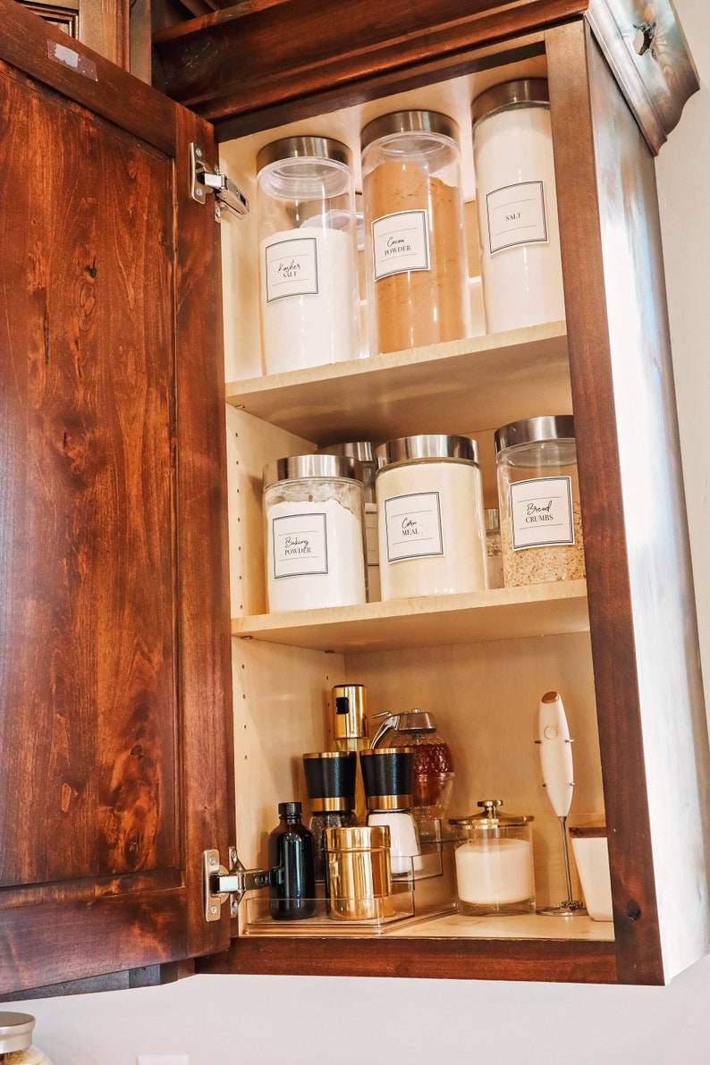 labeled kitchen containers in a cupboard