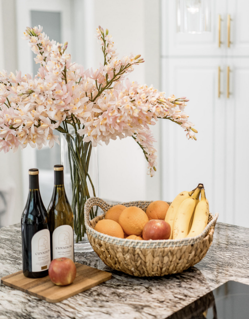 Kitchen Island with Metal Tray of Flowers, Containers and Bowls