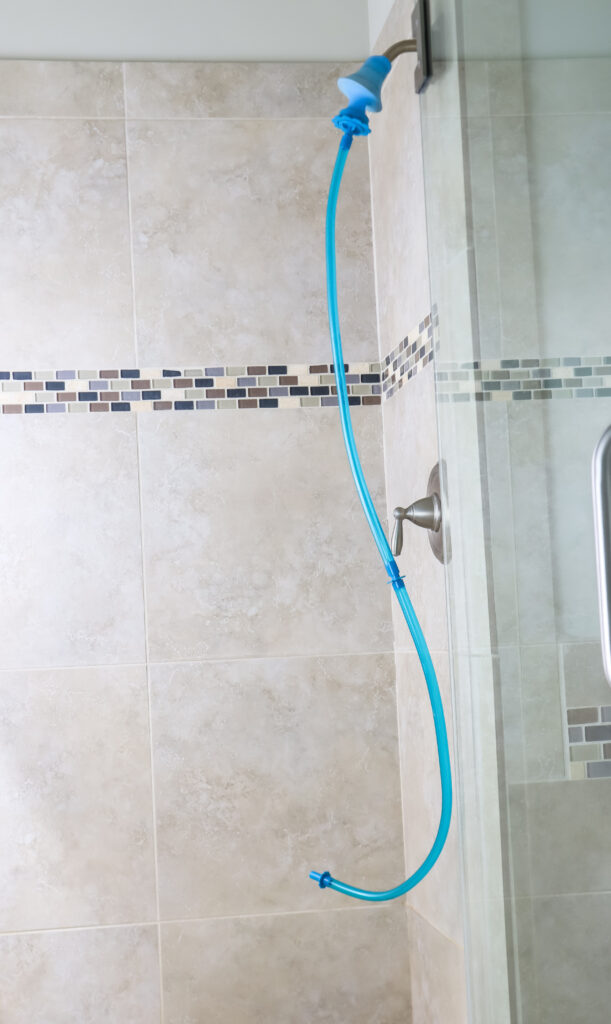https://practicalperfectionut.com/wp-content/uploads/2022/05/easy-way-to-rinse-the-shower-611x1024.jpg