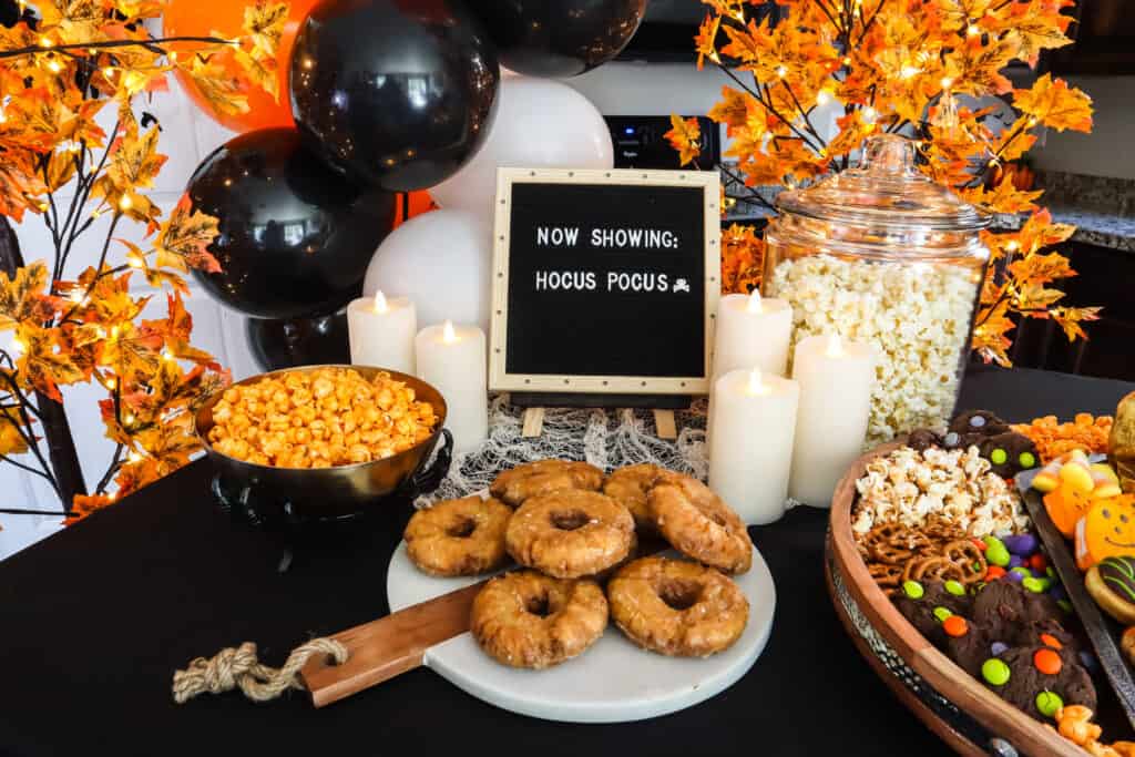 orange and black movie party treat table