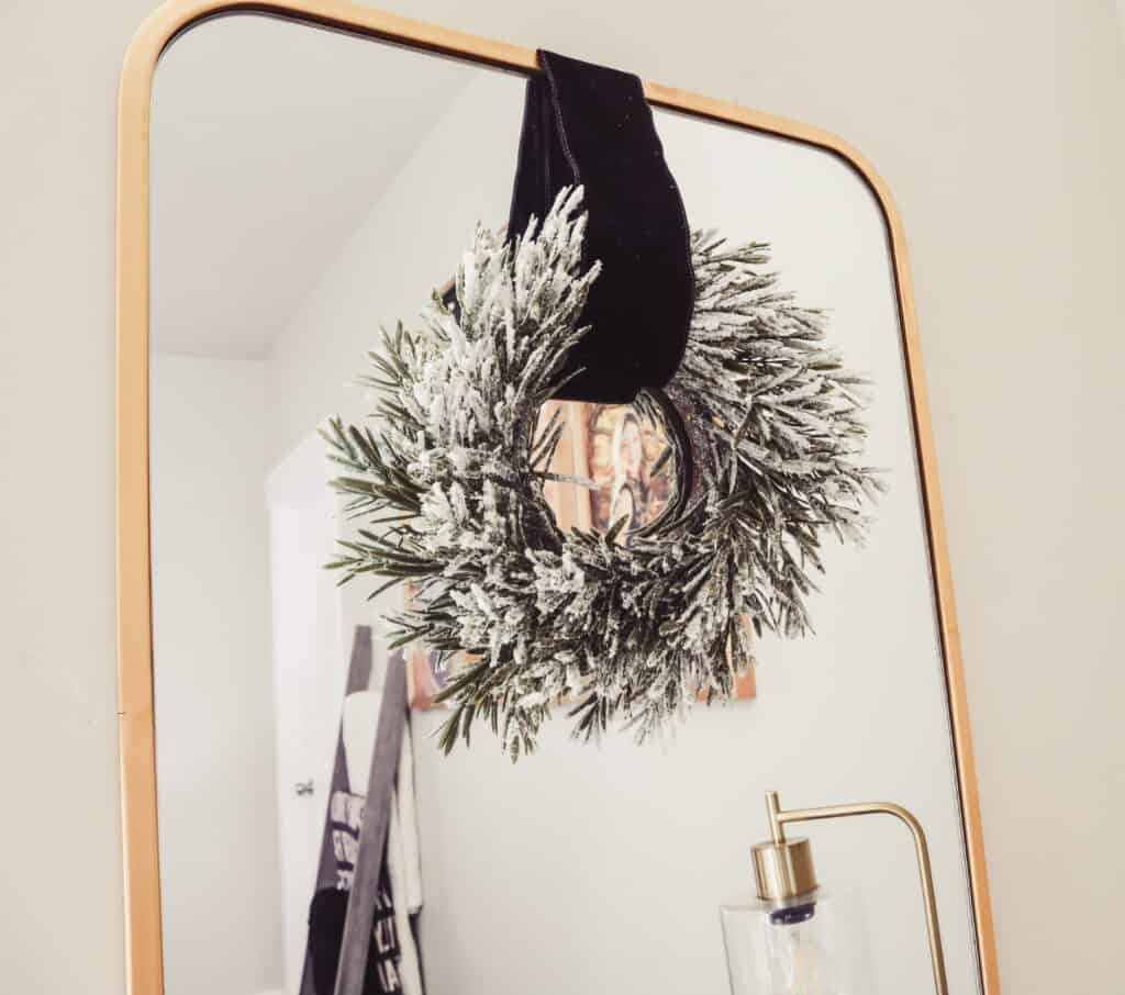 Master bedroom Christmas wreaths above the nightstands