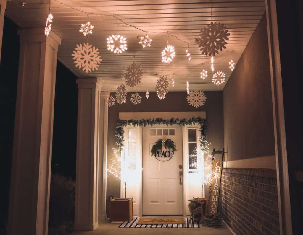 winter porch decorations with lighted snowflakes