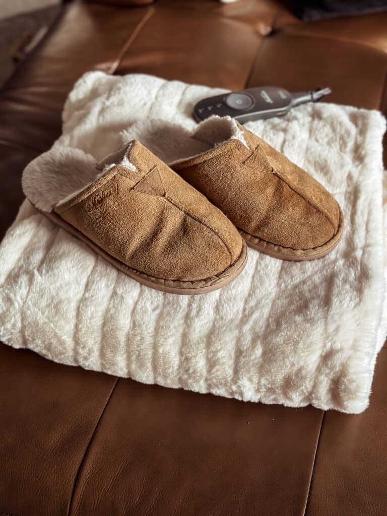 comfy slippers and a heated blanket to stay warm in the winter