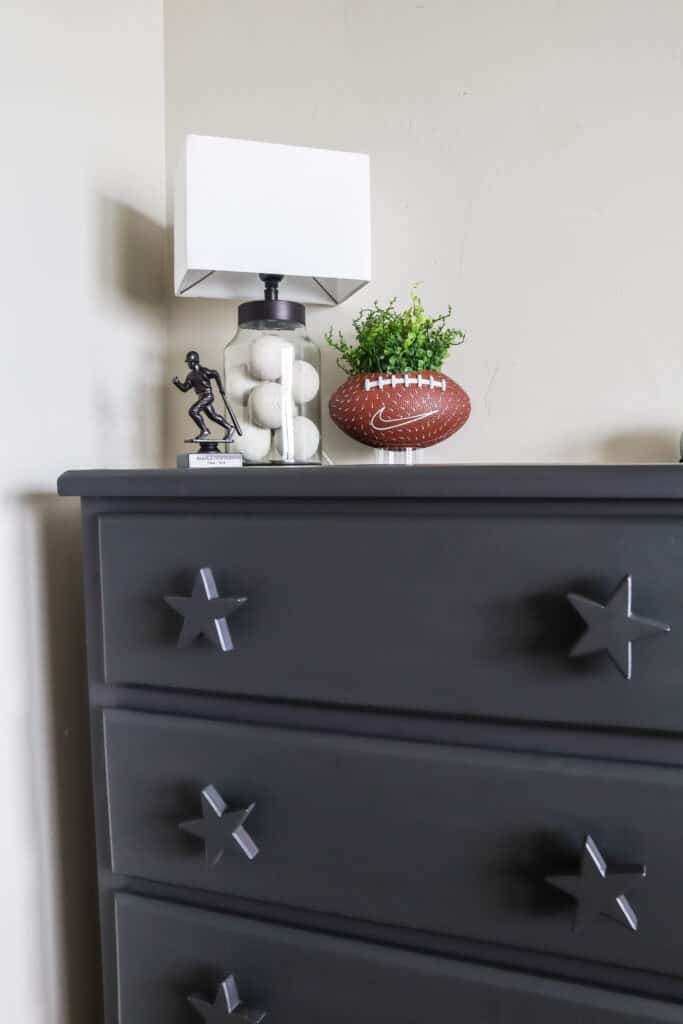 diy football planter and lacrosse balls in a glass lamp for sports bedroom decor