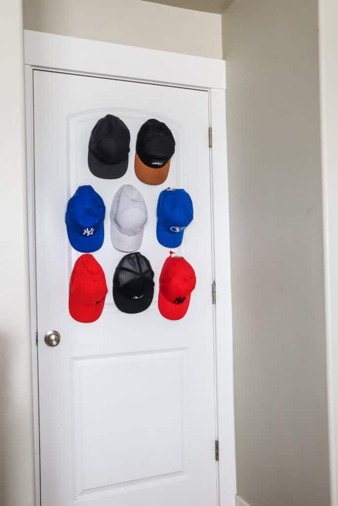 how to store and organize hats on the back of a door