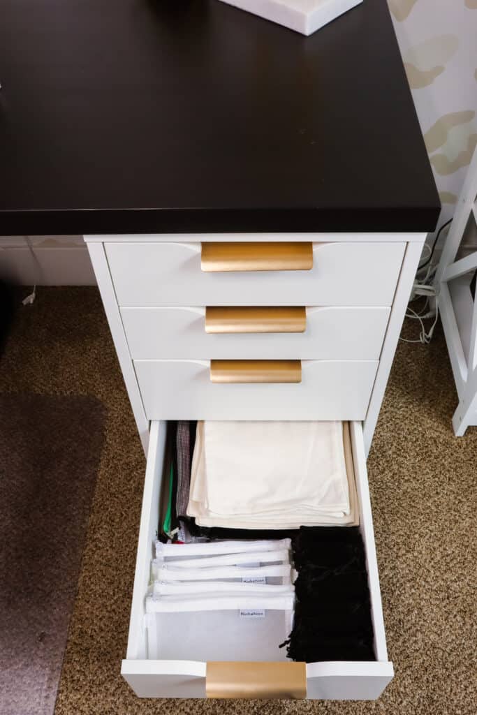 use desk organizers to organize desk drawers